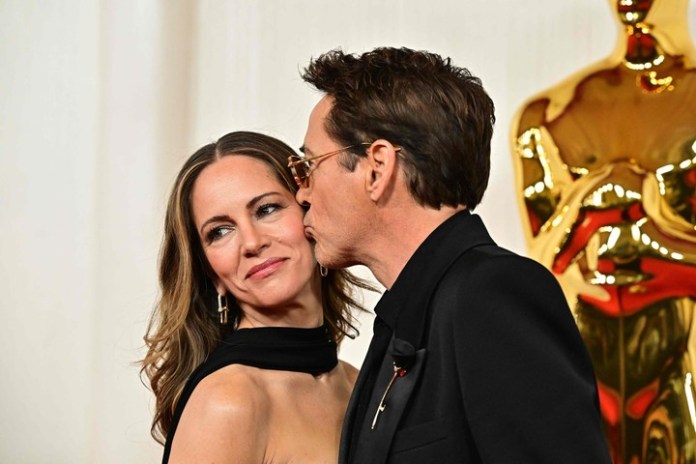 Robert Downey Jr. y su esposa Susan Downey. Él dice que ella lo salvó. Y juntos forman un equipo. Foto: AFP